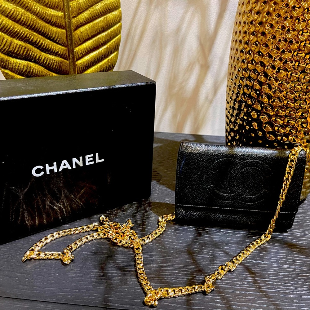 Chanel CC Black Caviar Flap with chain and authentication card.